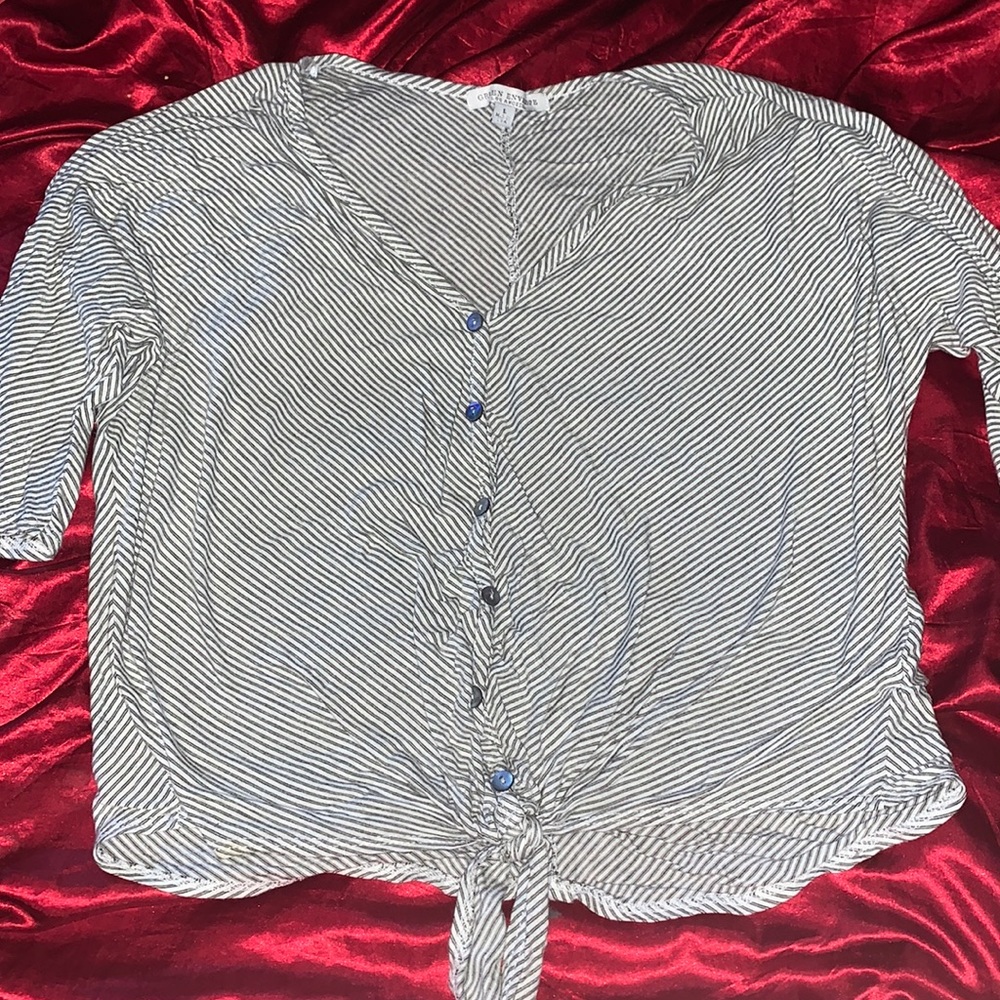 Black and white stripped button up top. Shows a little belly. Super cute!